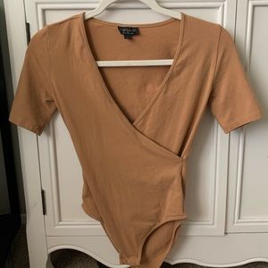 Nude Bodysuit with Snap Closure.
